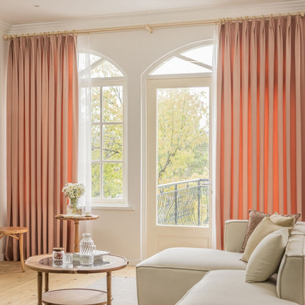 a living room filled with furniture and a large window