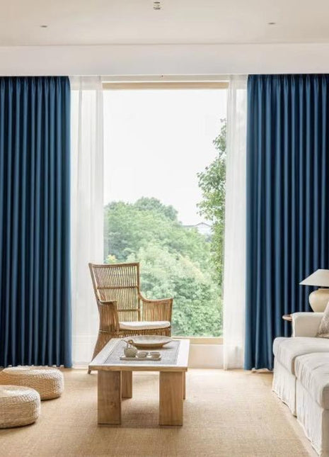 a living room filled with furniture and a large window