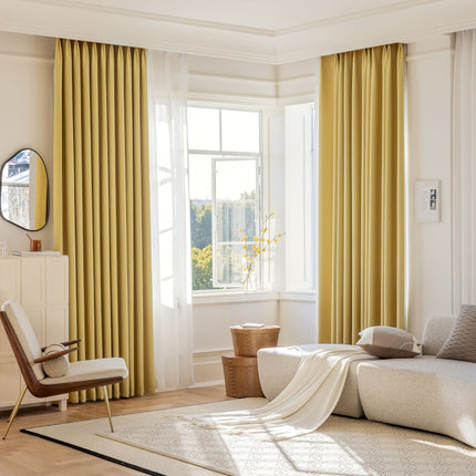 a living room filled with furniture and a large window