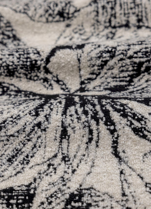 a close up of a black and white area rug
