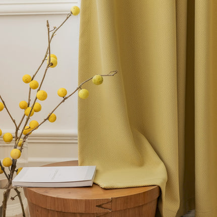 a vase with some yellow balls on it