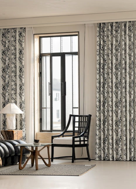 a living room filled with furniture and a large window