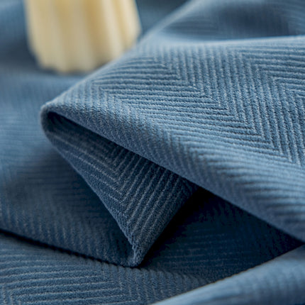 a close up of a blue cloth with a toothbrush