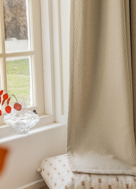 a vase of flowers sitting on a window sill