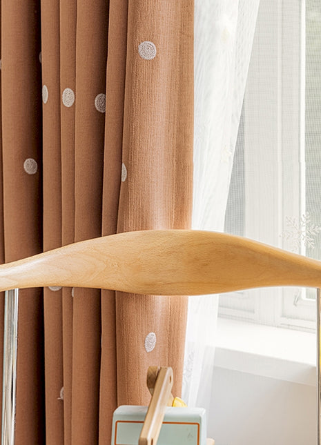 a wooden paddle sitting on top of a table next to a window