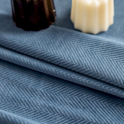a close up of a cloth with a bottle of soap