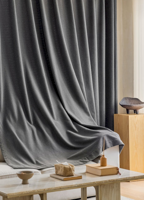 a living room with a couch and a table